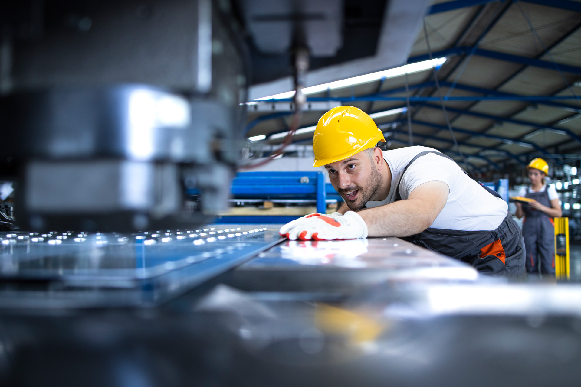 Glass manufacturing factory. Workers in the factory.